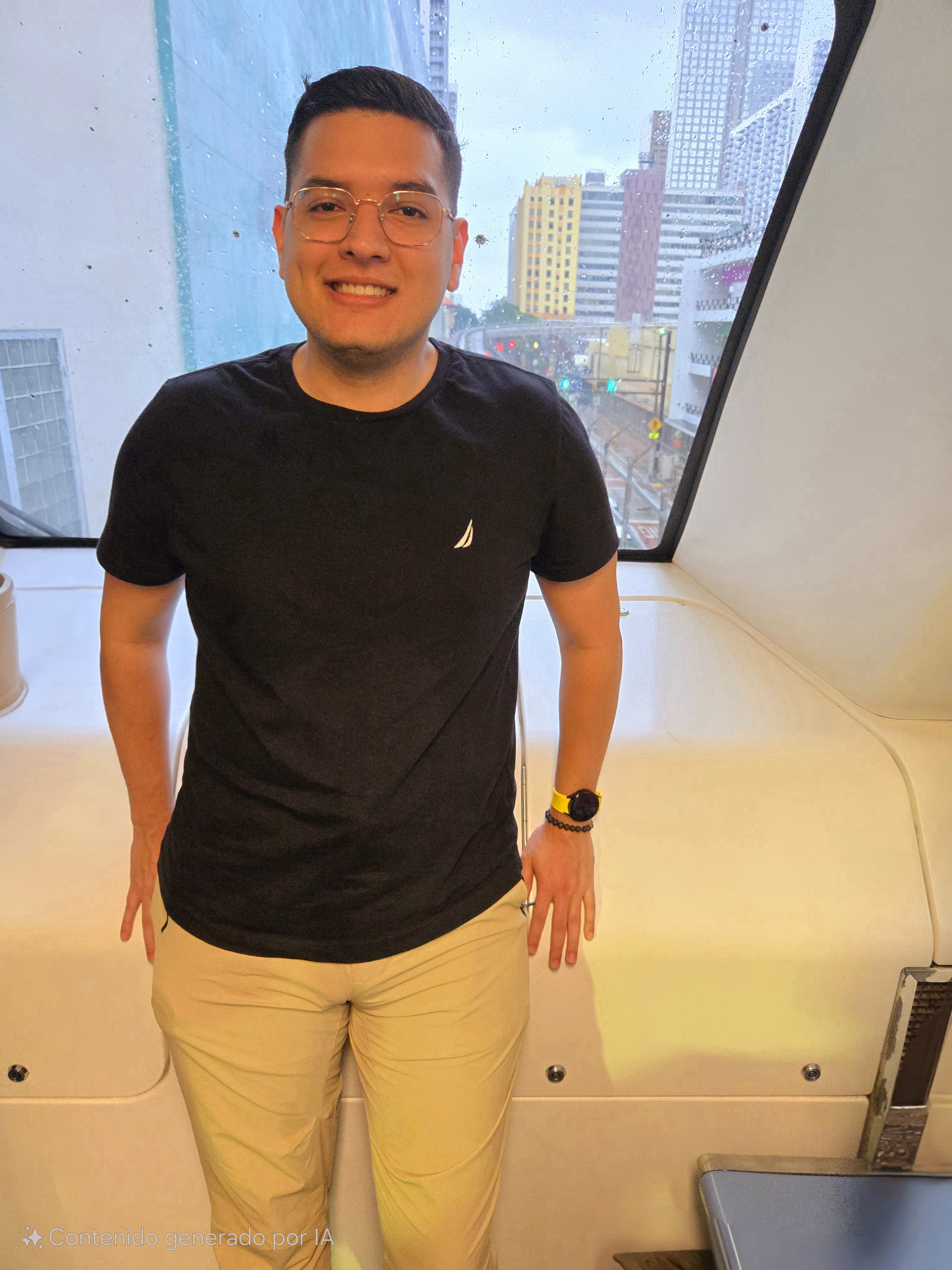 Kevin Nieto smiling in a train station